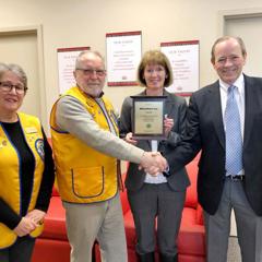 The Lions Club present Russ & Sharon Culver with plaque to recognize their support throughout the Christmas season.